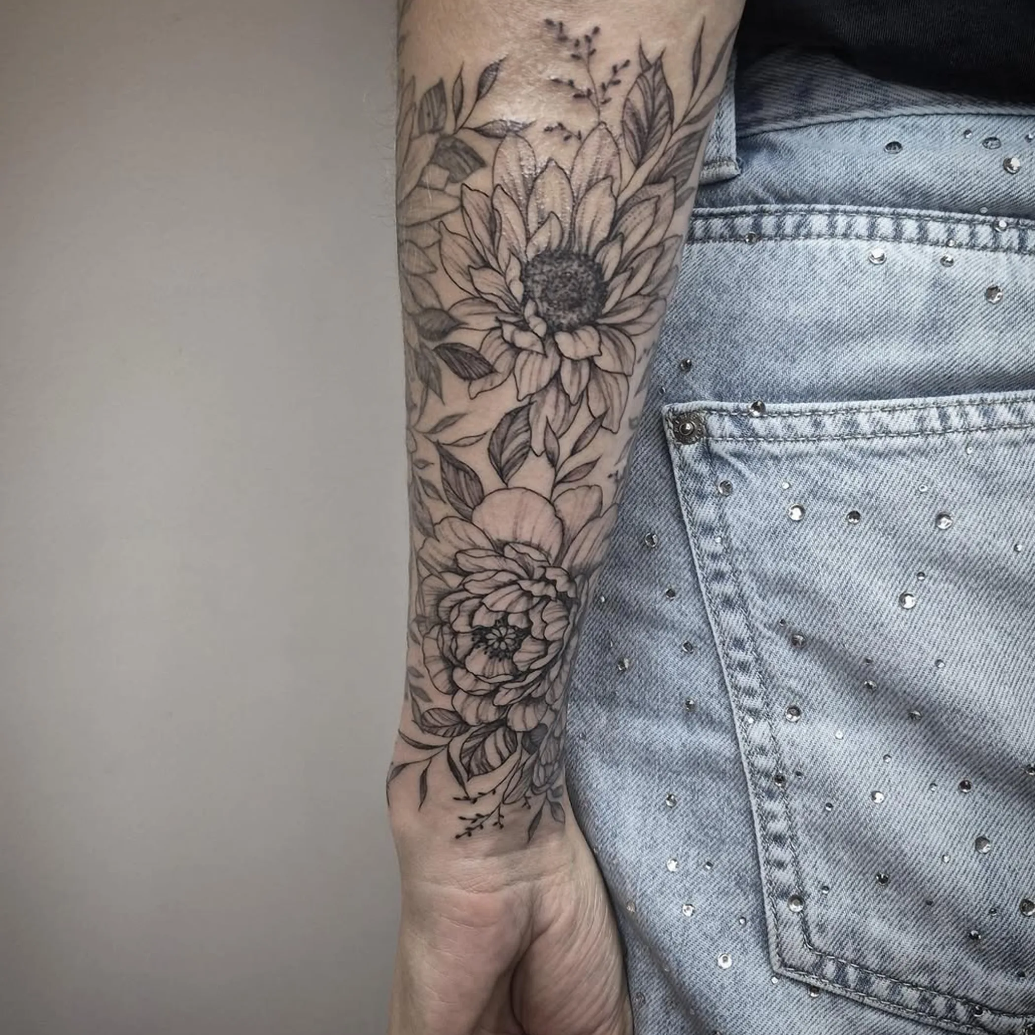 daisy-style flower tattoo