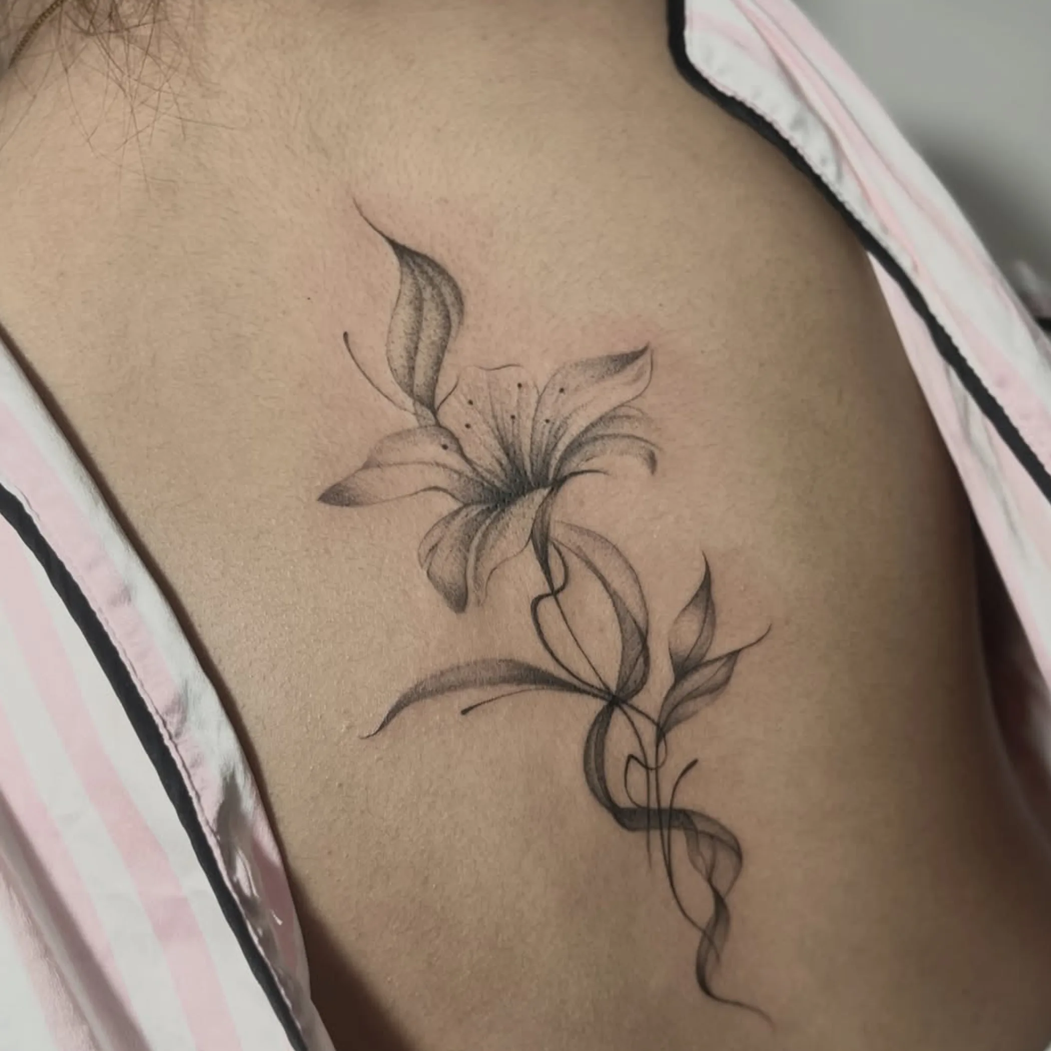 fine-line flower tattoo