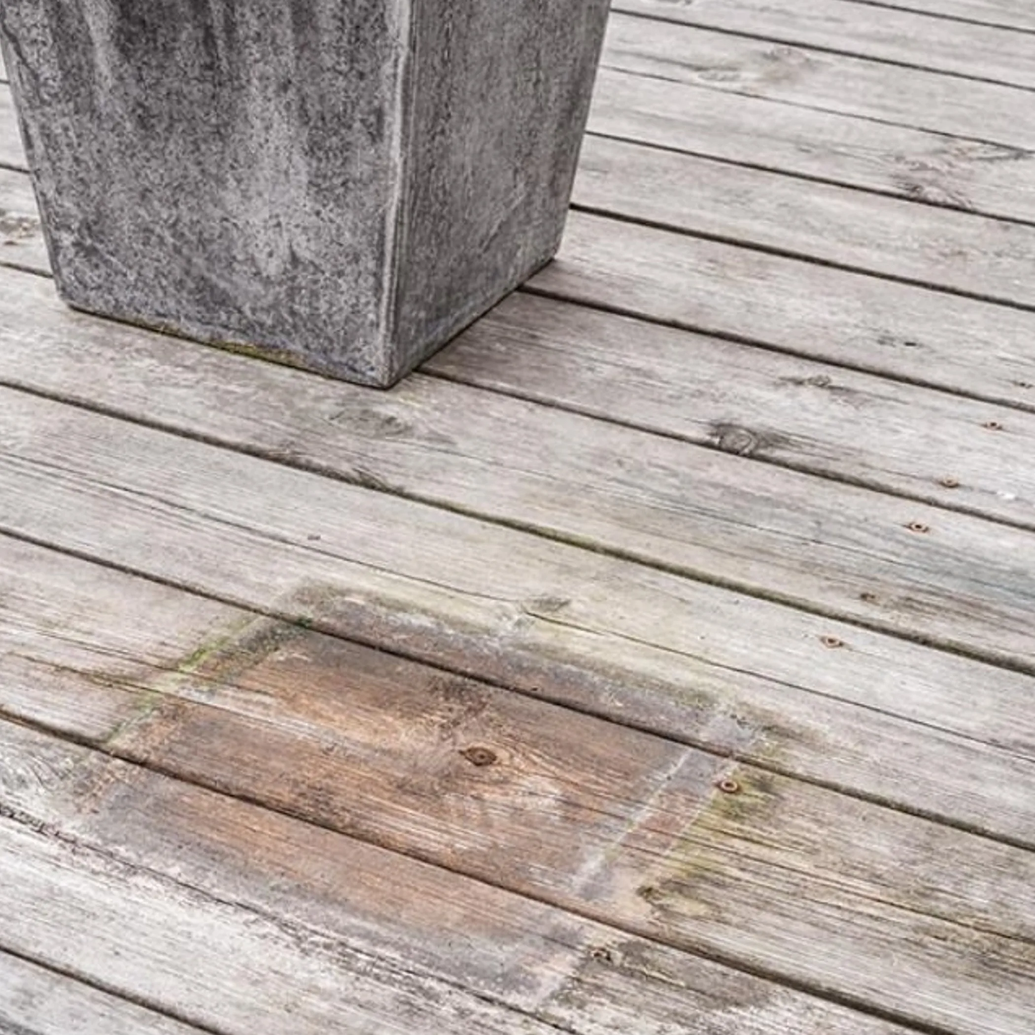 weathered outdoor wooden deck and planter