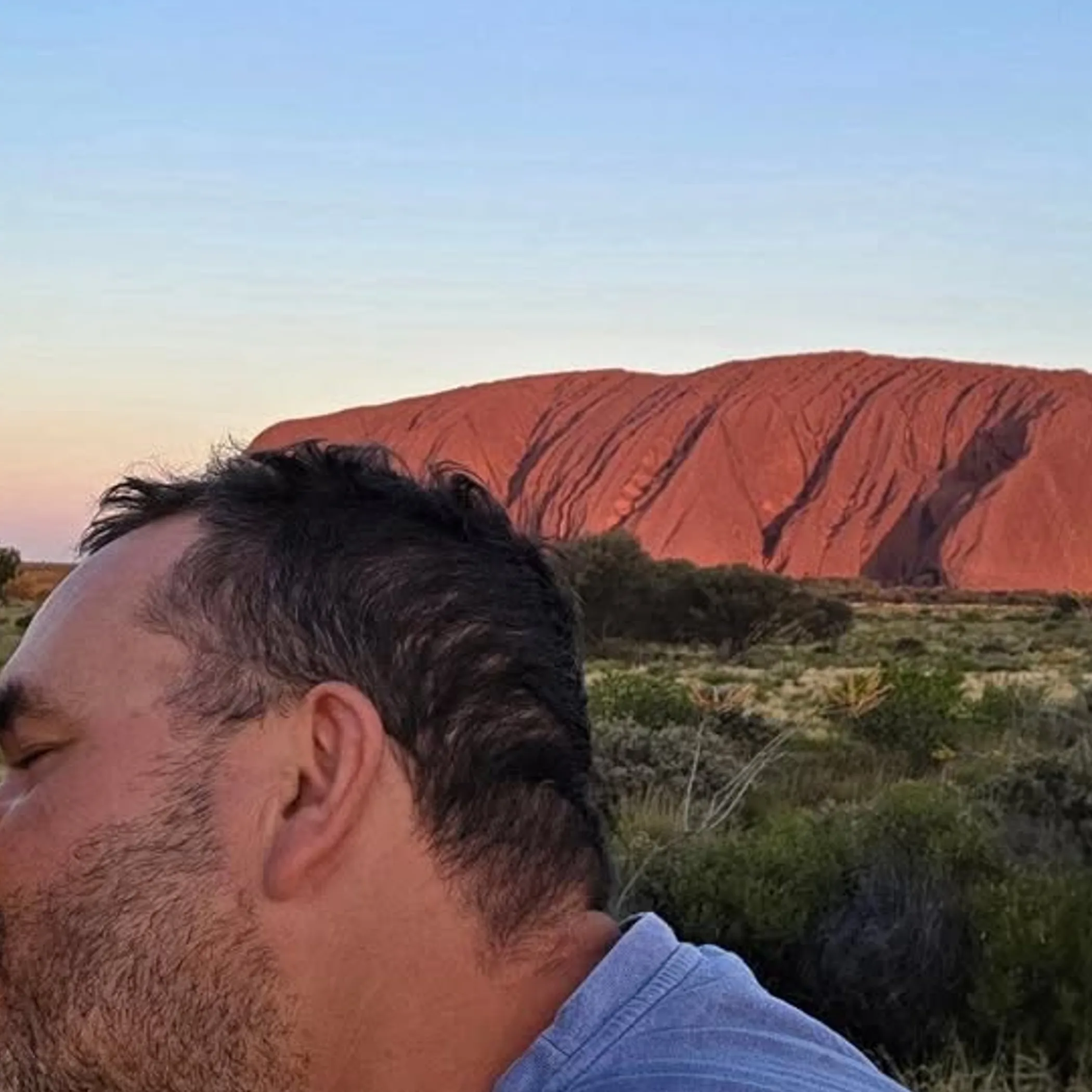 uluru in a clear travel photograph